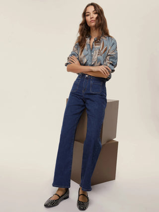 Jeans con tasche applicate