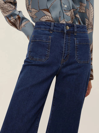 Jeans con tasche applicate