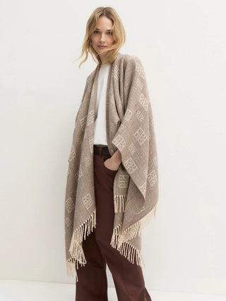 Poncho jacquard con frange