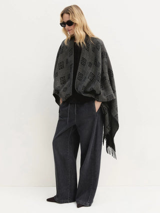 Poncho jacquard con frange